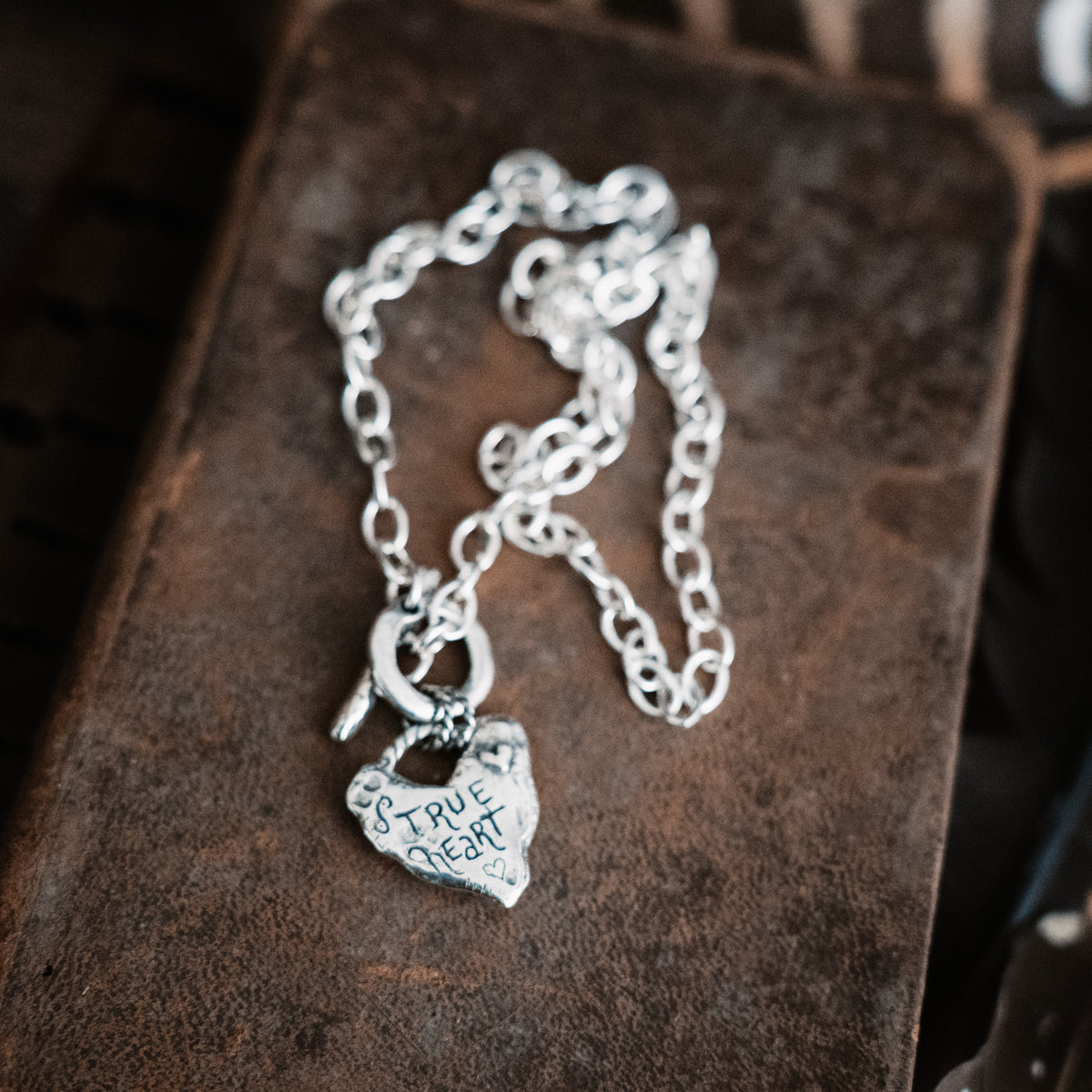 silver necklace with heart pendant