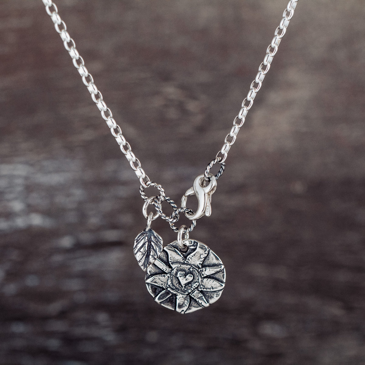 silver necklace with sunshine pendant