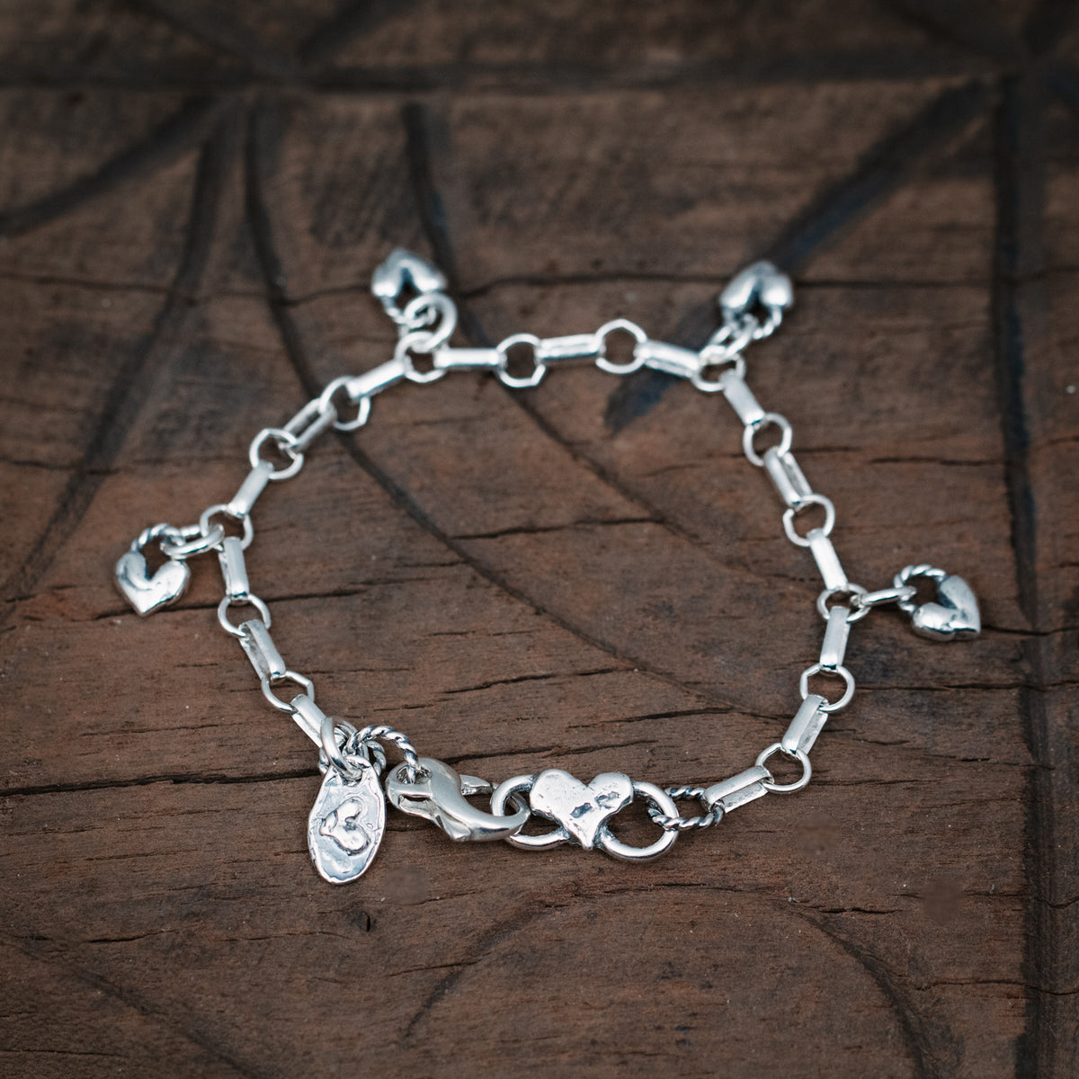 silver charm bracelet with hearts