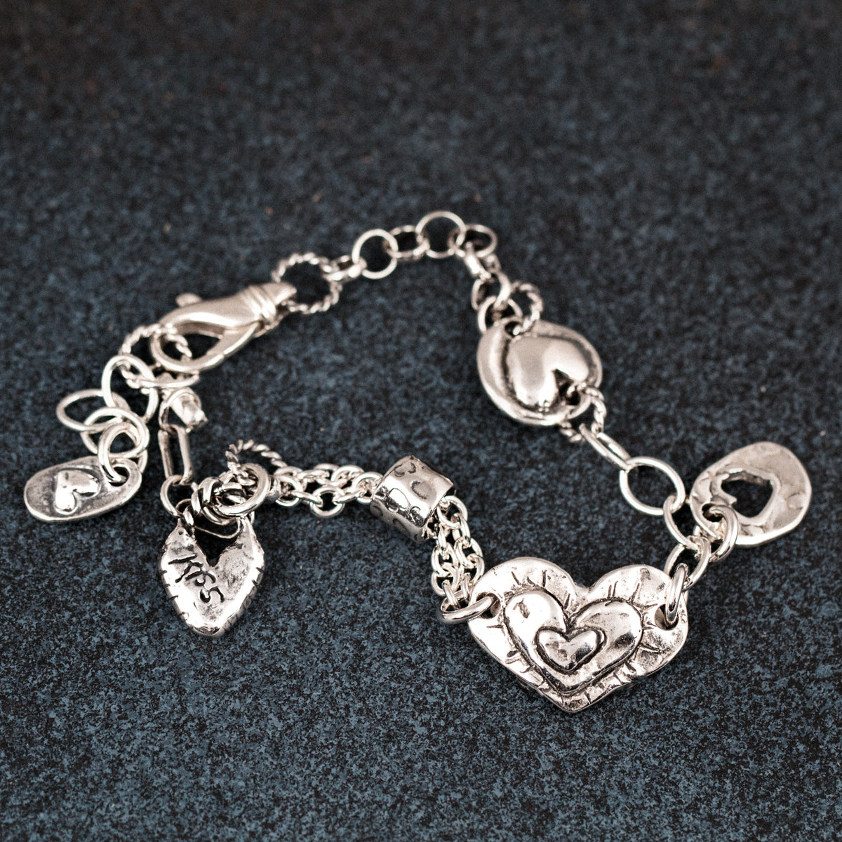 silver charm bracelet with hearts